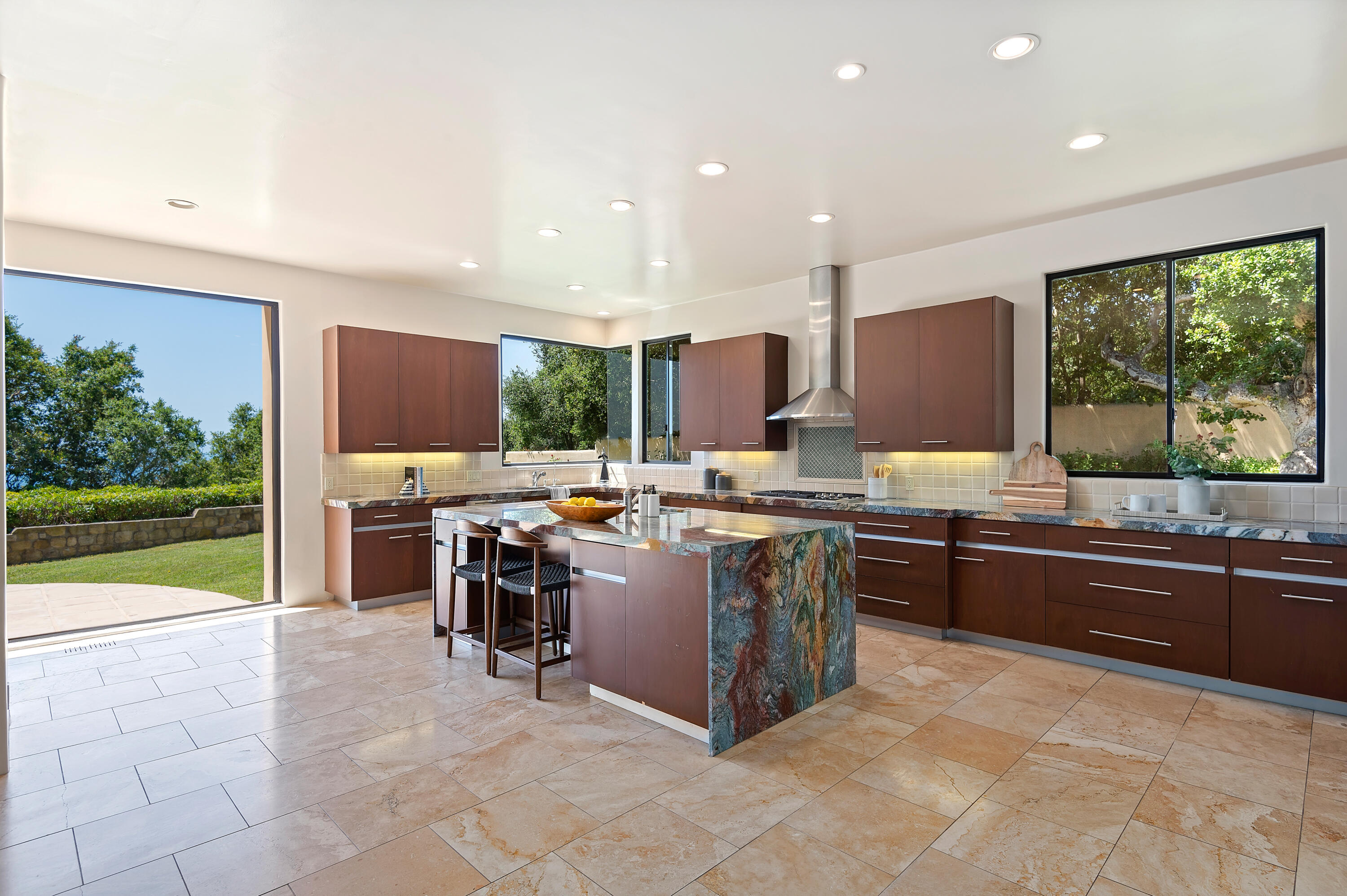 1181 Glenview Road Santa Barbara, CA 93108 - Photo 13 of 46 a large kitchen with kitchen island a sink a counter top stainless steel appliances and cabinets
