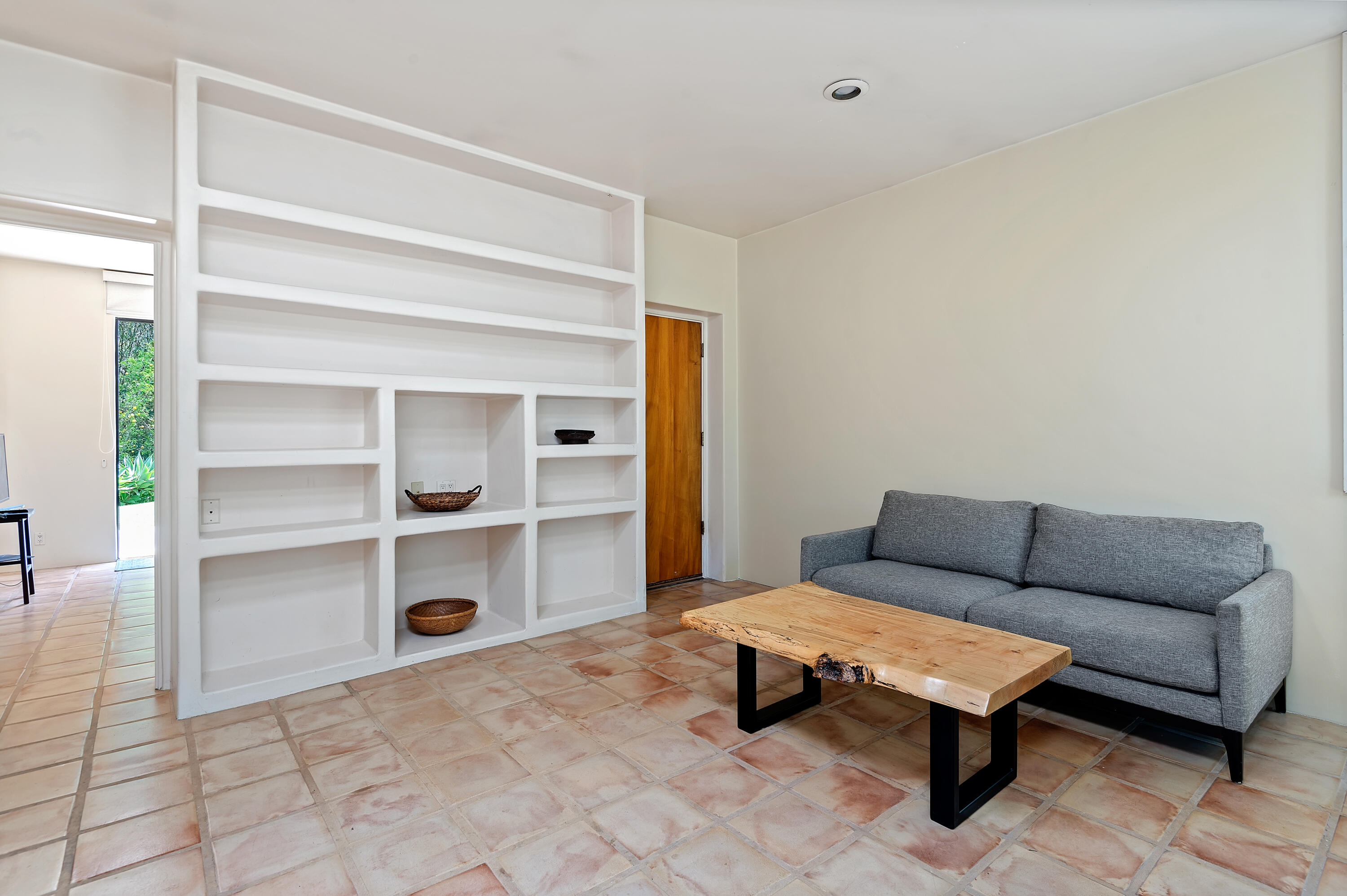 1181 Glenview Road Santa Barbara, CA 93108 - Photo 34 of 46 a living room with furniture and a book shelf