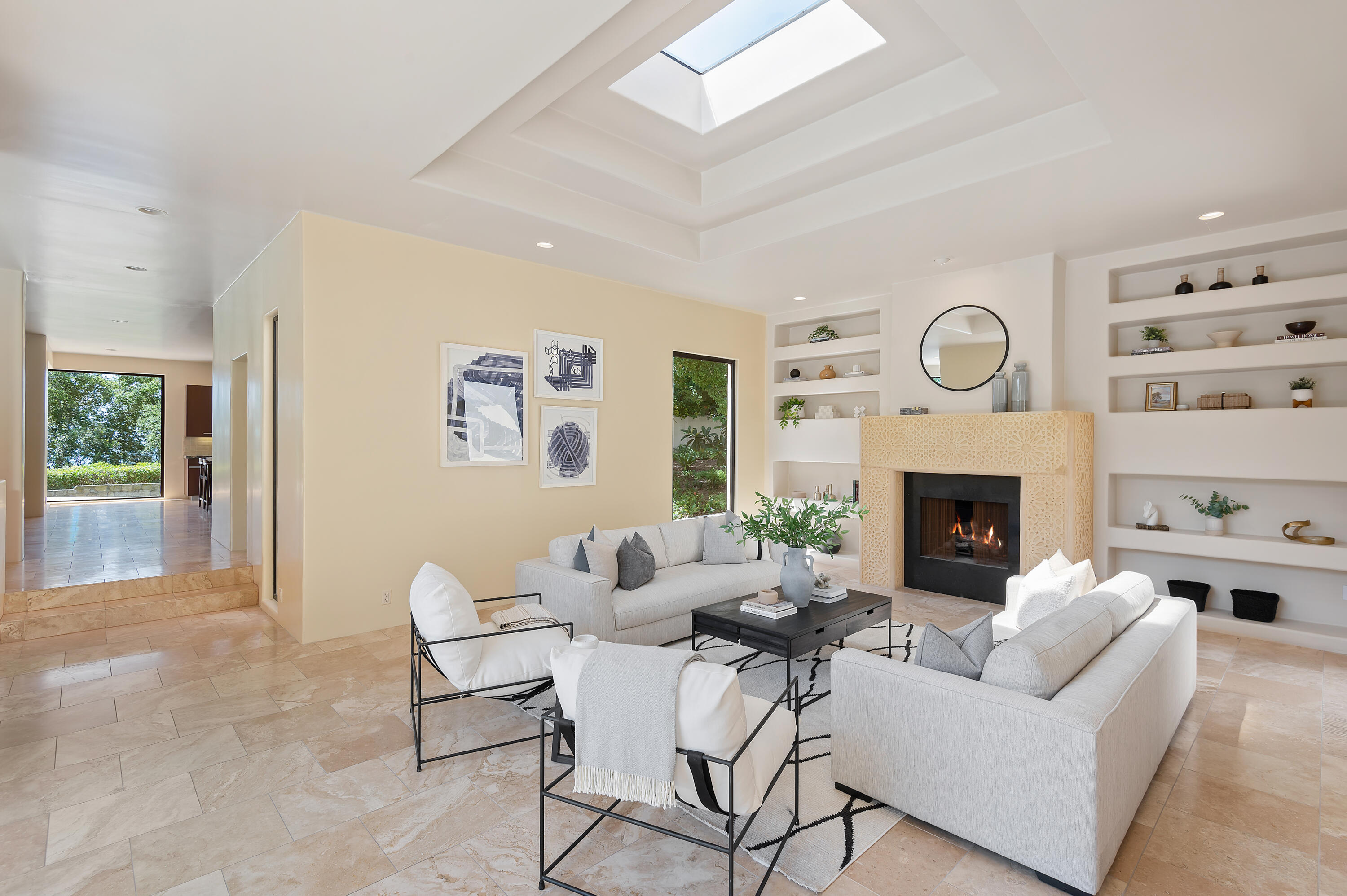 1181 Glenview Road Santa Barbara, CA 93108 - Photo 6 of 46 a living room with furniture a clock and a fireplace