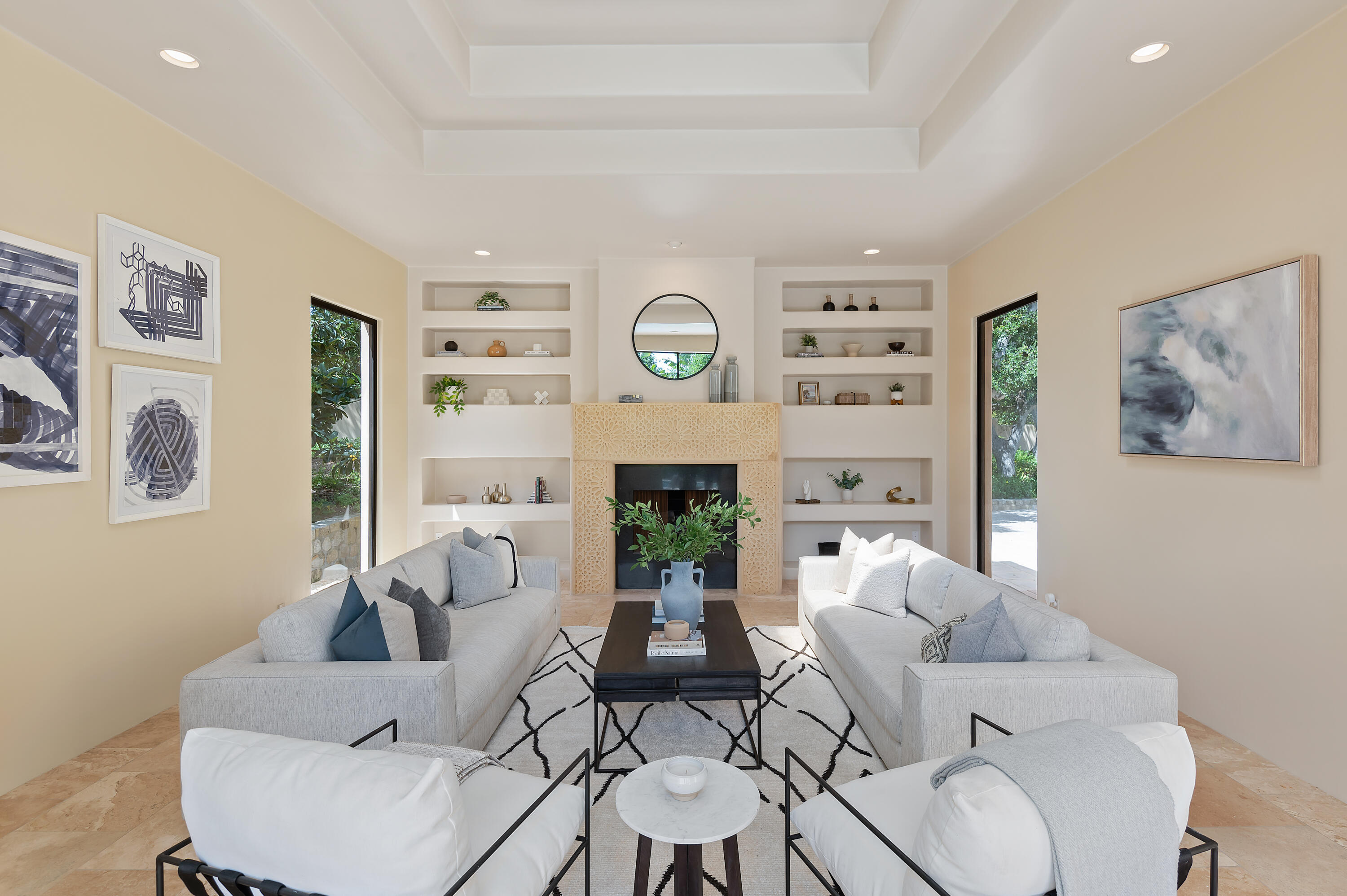 1181 Glenview Road Santa Barbara, CA 93108 - Photo 7 of 46 a living room with furniture a fireplace and a large mirror