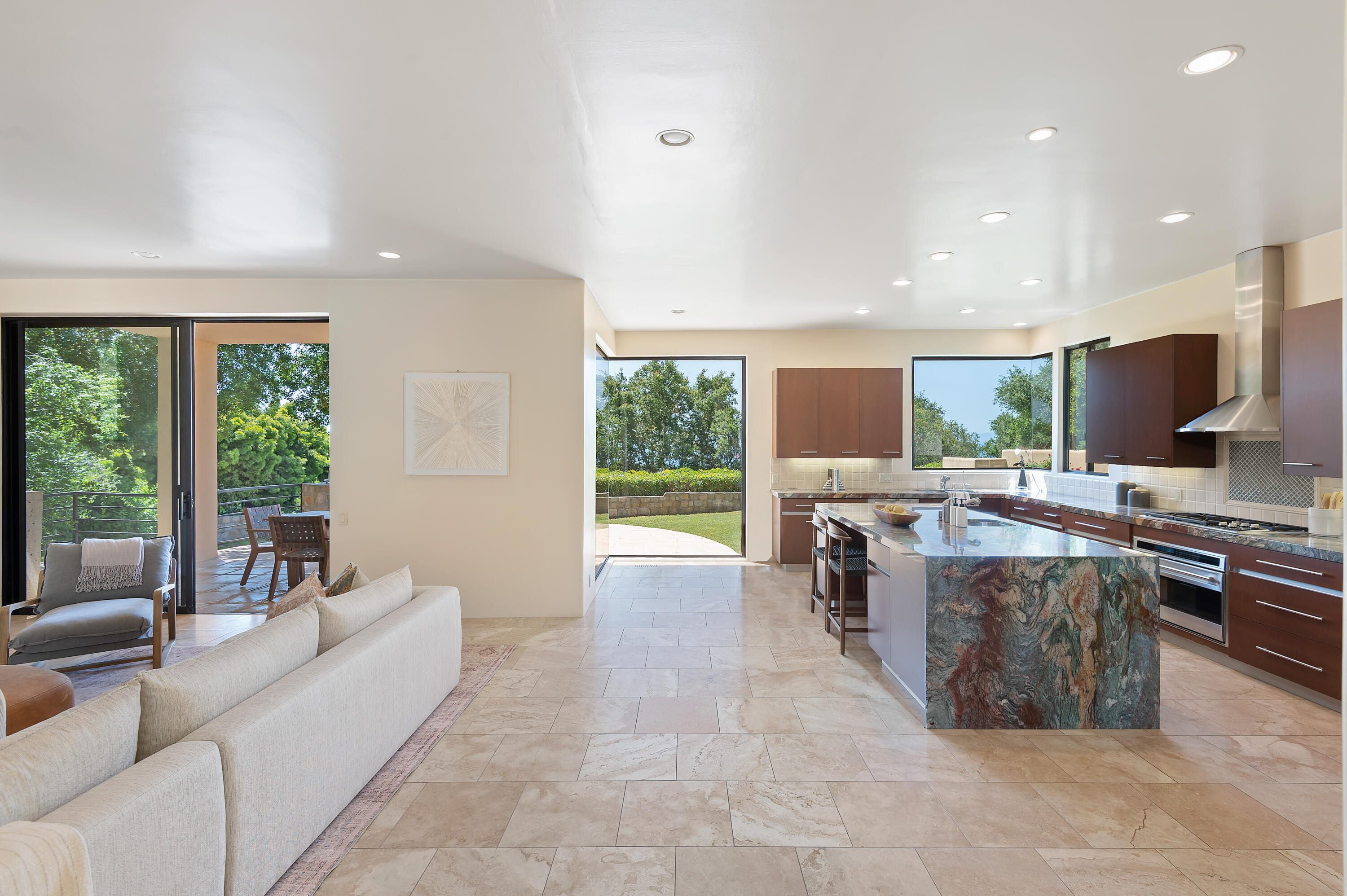 1181 Glenview Road Santa Barbara, CA 93108 - Photo 9 of 46 a living room with furniture a large window and a flat screen tv