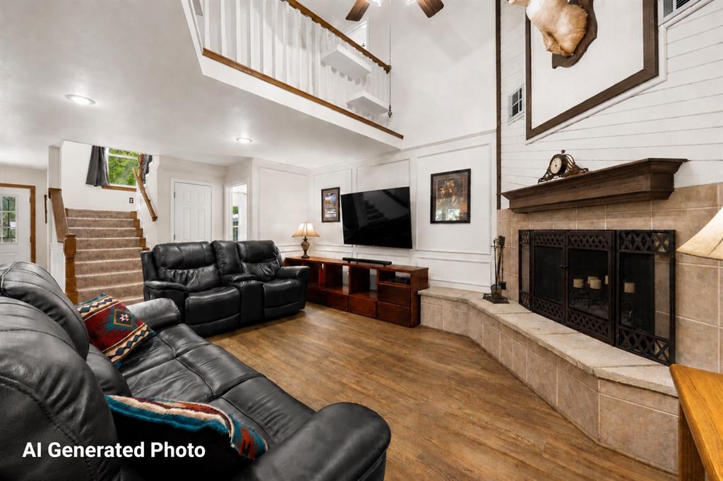 881 Wild Road Van Alstyne, TX 75495 - Photo 9 of 40 a living room with furniture a flat screen tv and a fireplace