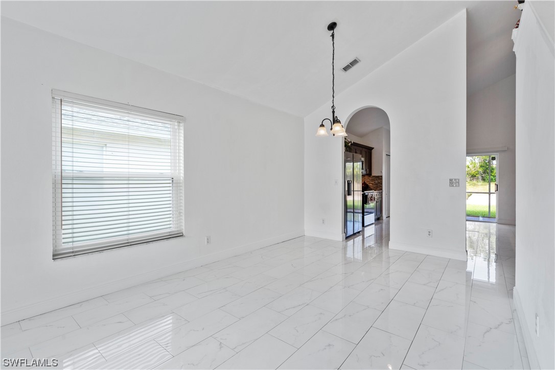 21660 Windham Run Estero, FL 33928 - Photo 11 of 32 a view of an empty room with window and cabinet