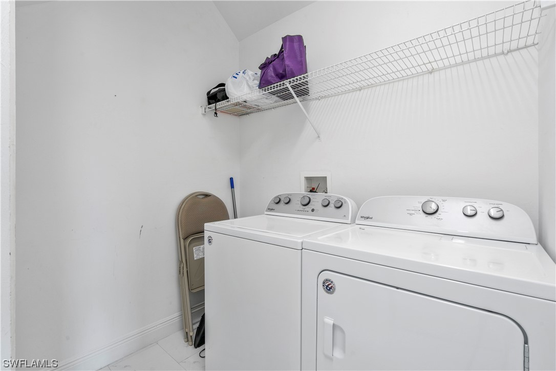 21660 Windham Run Estero, FL 33928 - Photo 23 of 32 a utility room with dryer and washer