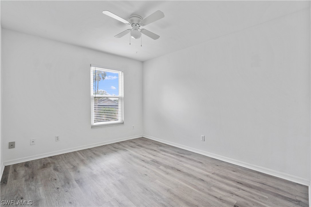 21660 Windham Run Estero, FL 33928 - Photo 25 of 32 an empty room with a window