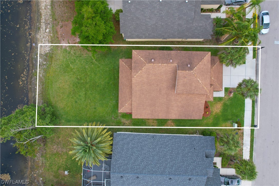 21660 Windham Run Estero, FL 33928 - Photo 4 of 32 an aerial view of a house having yard