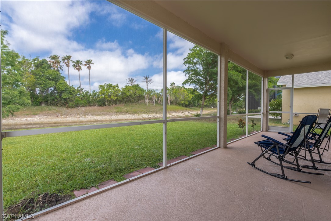 21660 Windham Run Estero, FL 33928 - Photo 7 of 32 a view of a chair and table in the garden