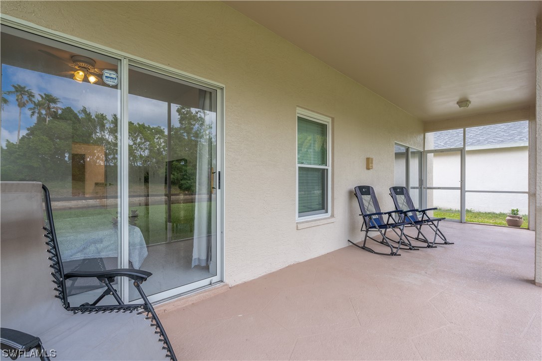 21660 Windham Run Estero, FL 33928 - Photo 8 of 32 a living room with furniture and a large window