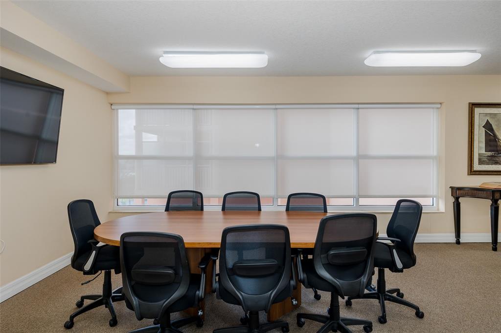 4516 Seagull Drive, Unit 411 New Port Richey, FL 34652 - Photo 38 of 47 a view of a workspace with furniture and a window