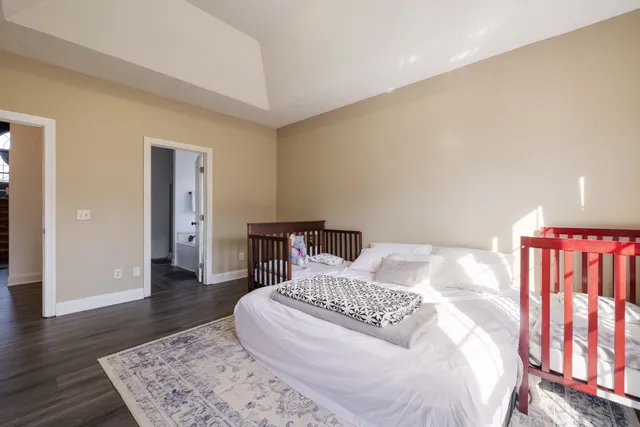 a bathroom with a double vanity sink a mirror and a shower
