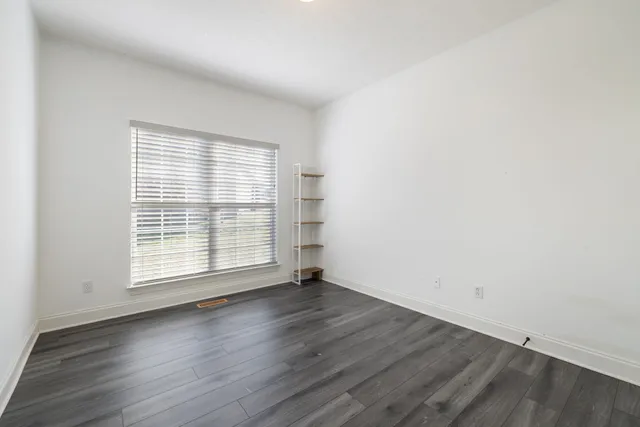 a bathroom with a sink toilet a mirror and shower