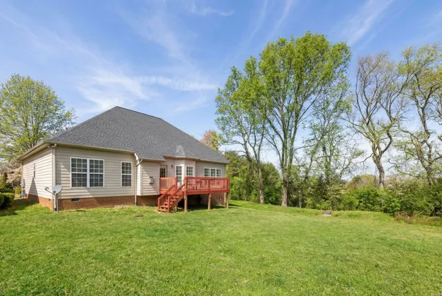 a balcony with table and chairs