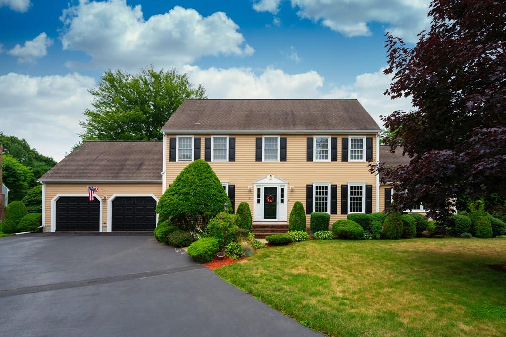 3 Tupelo Drive Hingham, MA 02043 - Photo 2 of 35 a front view of a house with a yard and garage