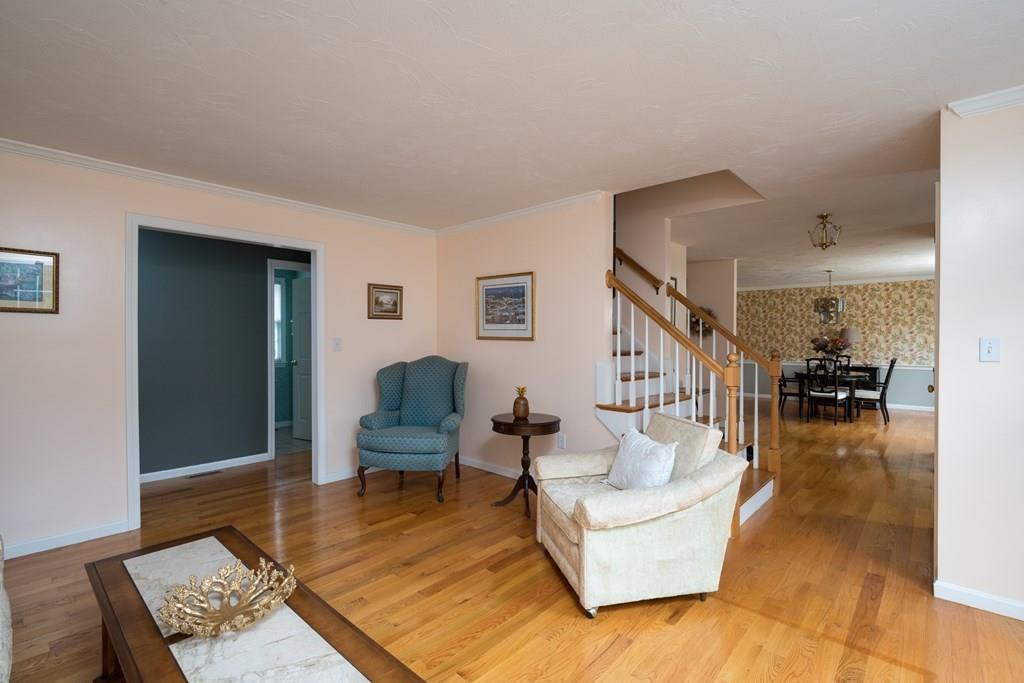 3 Tupelo Drive Hingham, MA 02043 - Photo 22 of 35 a living room with furniture and a wooden floor