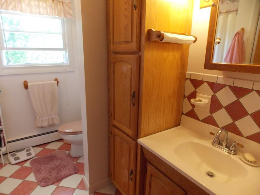 552 Front Ridge Road Orland, ME 04472 - Photo 20 of 26 Beautiful tiled bathroom.
