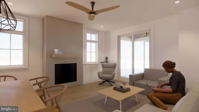 a living room with furniture a fireplace and a window