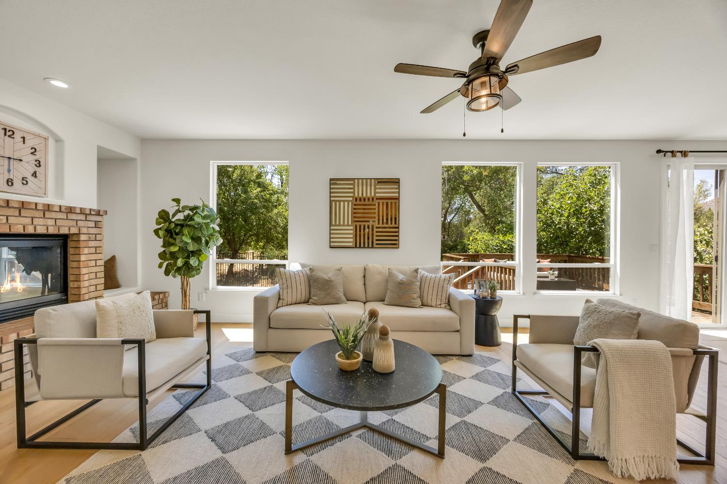 6041 Lockridge Drive Granite Bay, CA 95746 - Photo 24 of 67 a living room with furniture a large window and a fireplace
