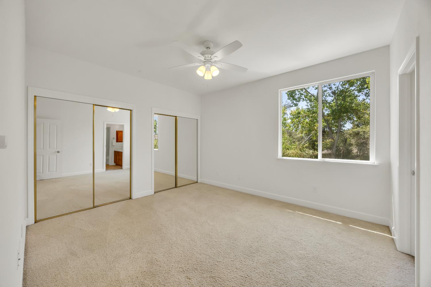 6041 Lockridge Drive Granite Bay, CA 95746 - Photo 46 of 67 an empty room with a ceiling fan and a window