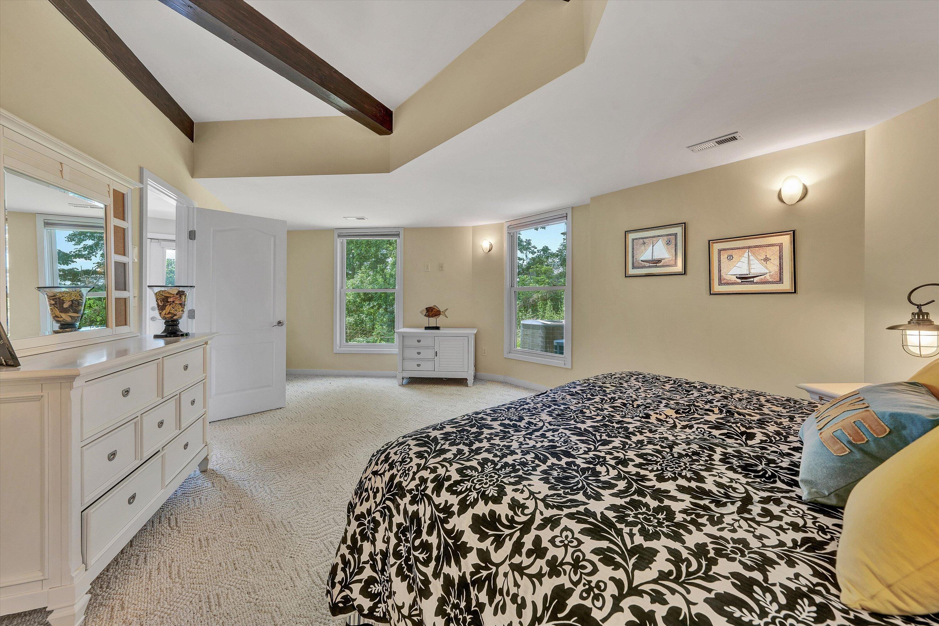 207 Winding Way Union Hall, VA 24176 - Photo 37 of 60 a spacious bedroom with a large bed and a dresser