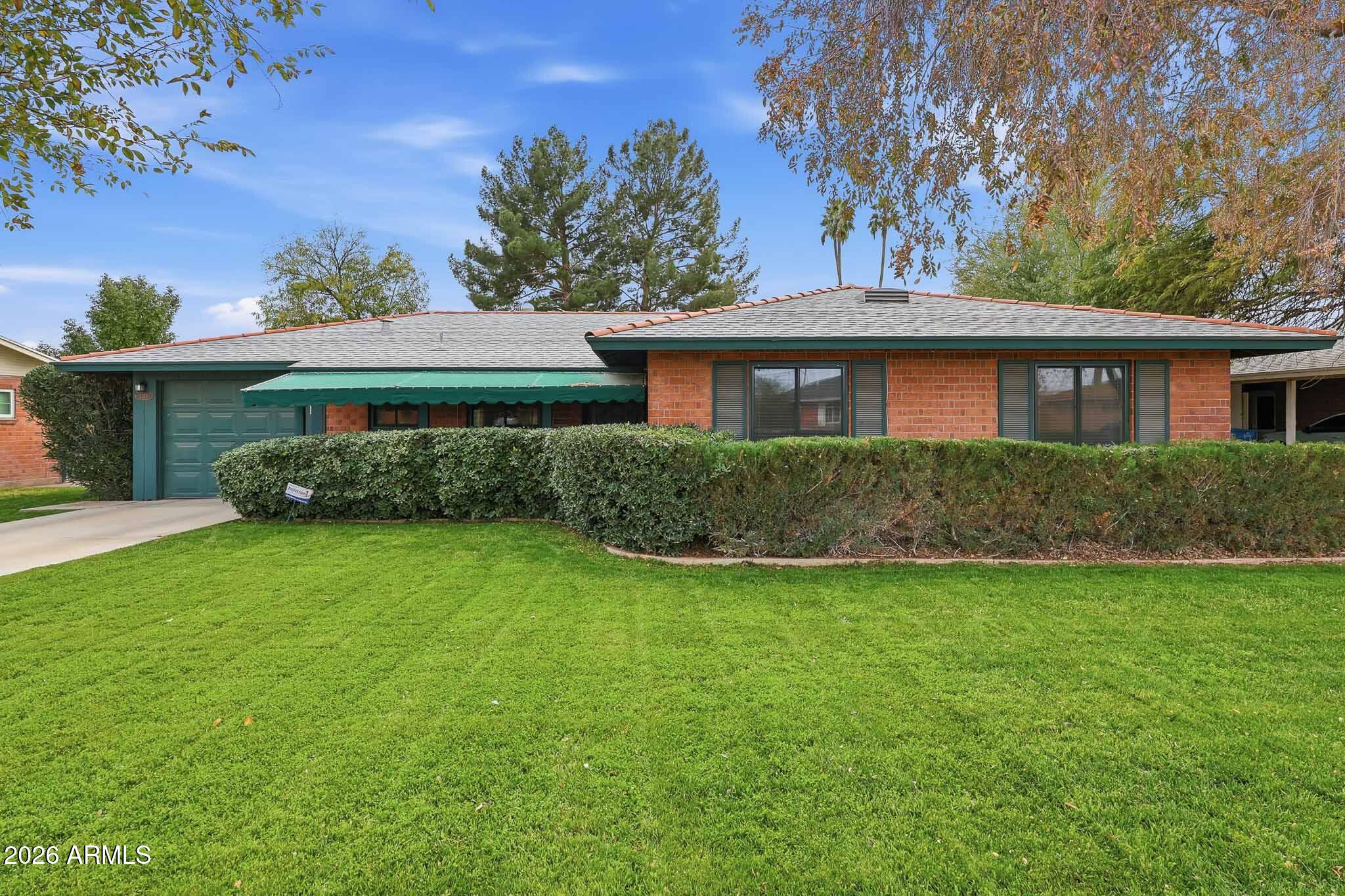 front view of a house with a yard