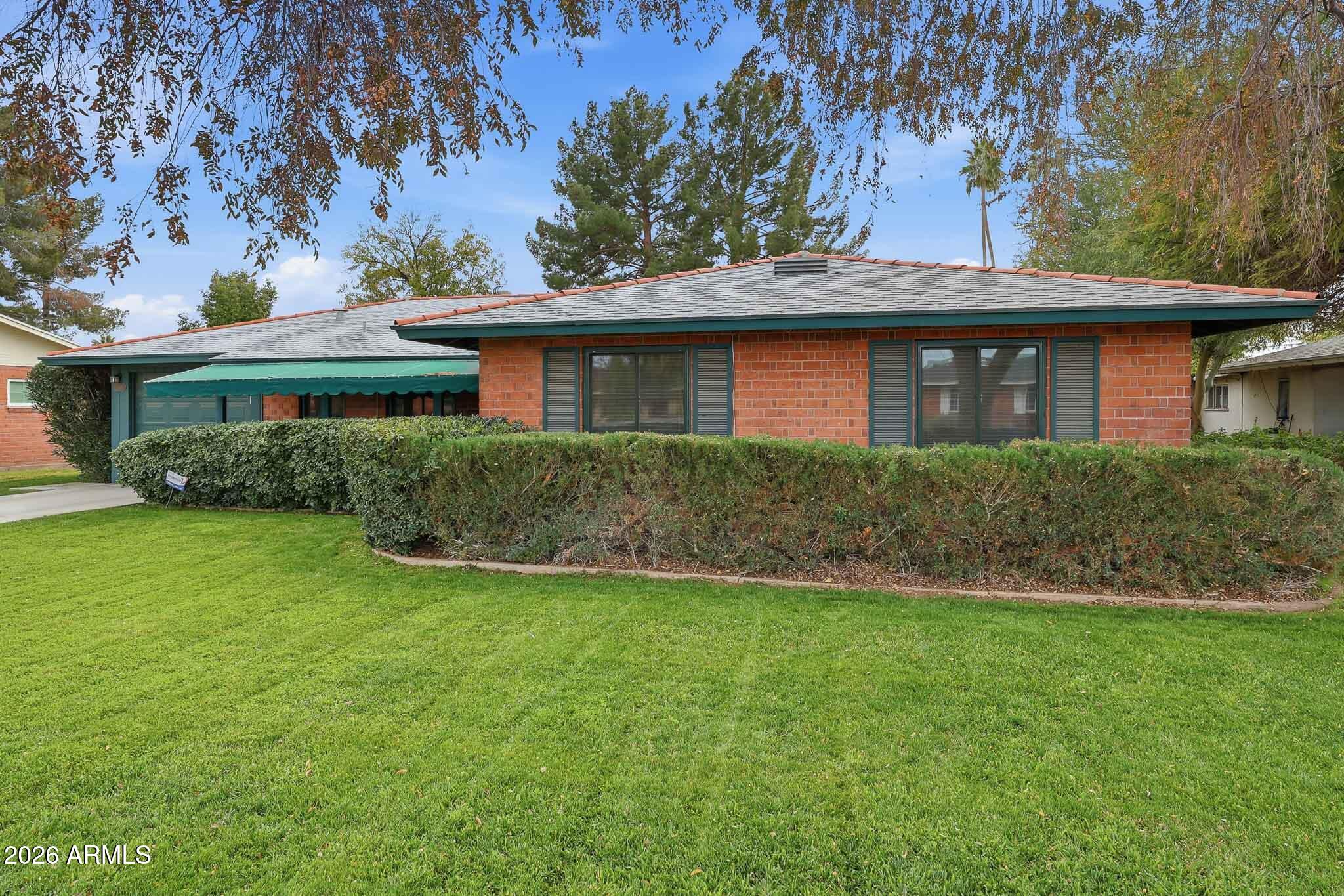 2215 West Earll Drive Phoenix, AZ 85015 - Photo 2 of 55 a front view of a house with a yard