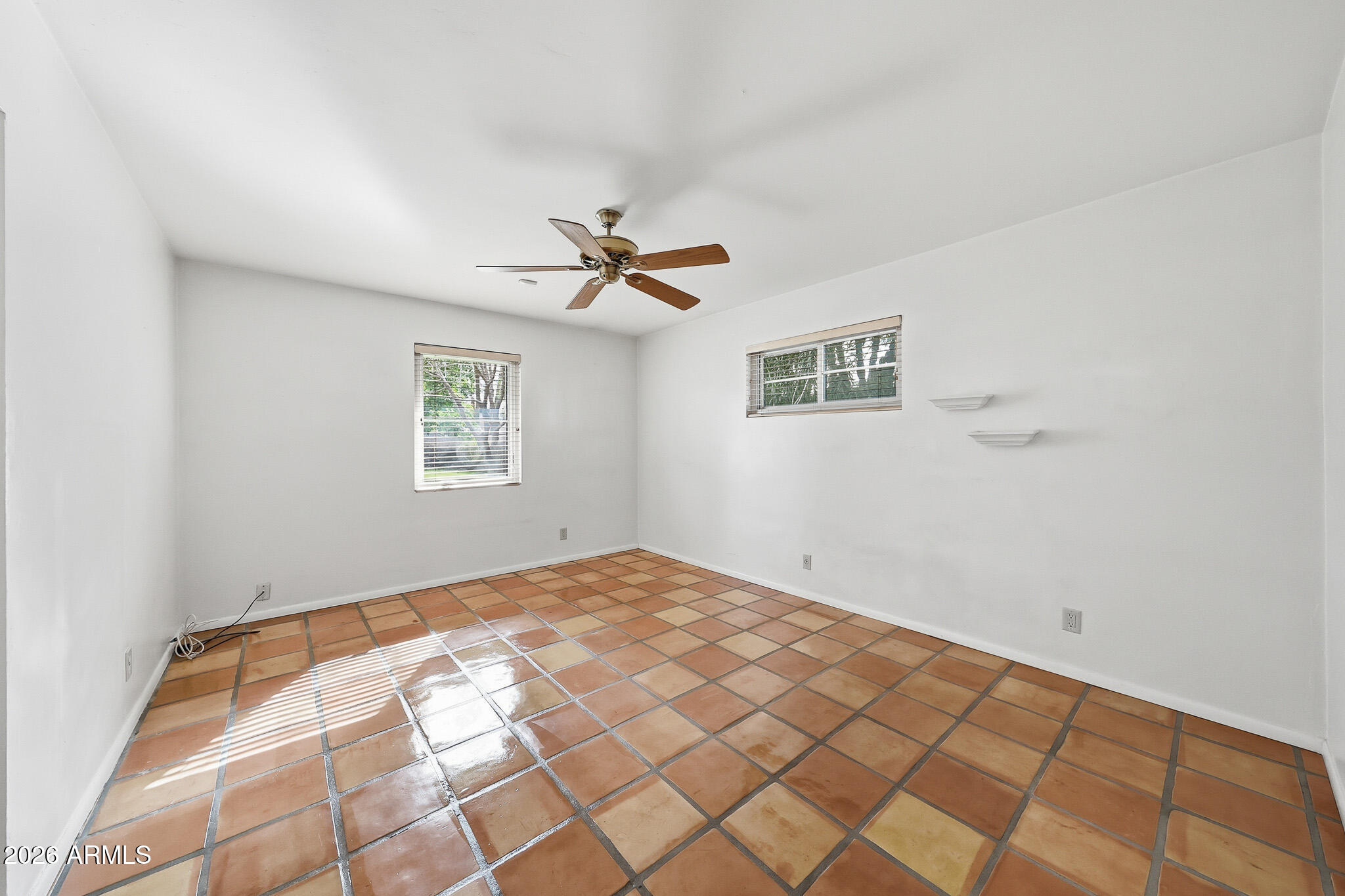 2215 West Earll Drive Phoenix, AZ 85015 - Photo 21 of 55 a view of a big room with a chandelier fan