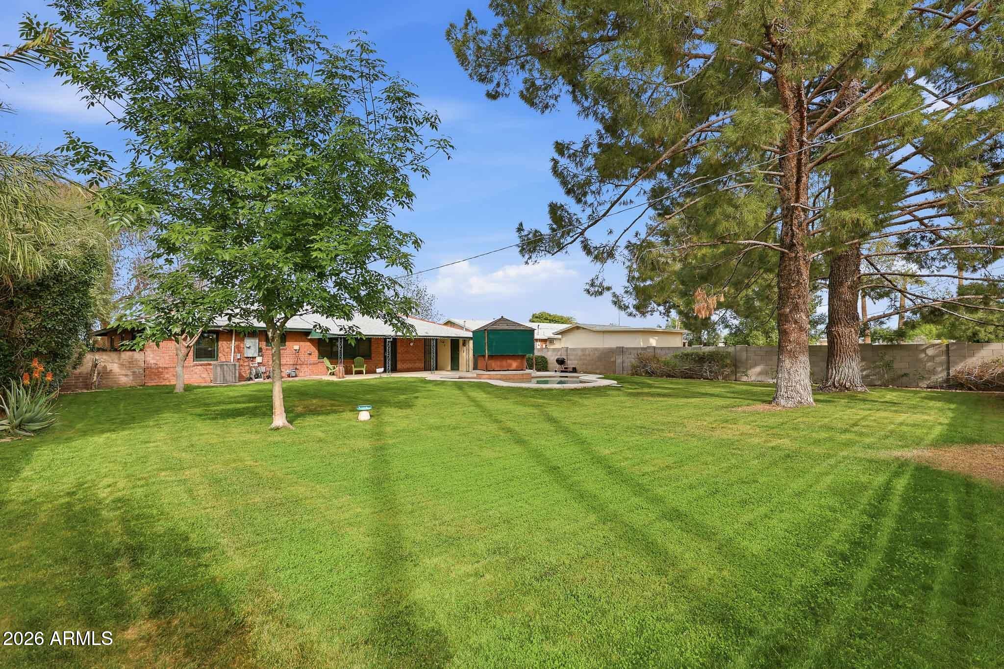 2215 West Earll Drive Phoenix, AZ 85015 - Photo 33 of 55 a view of a house with a yard