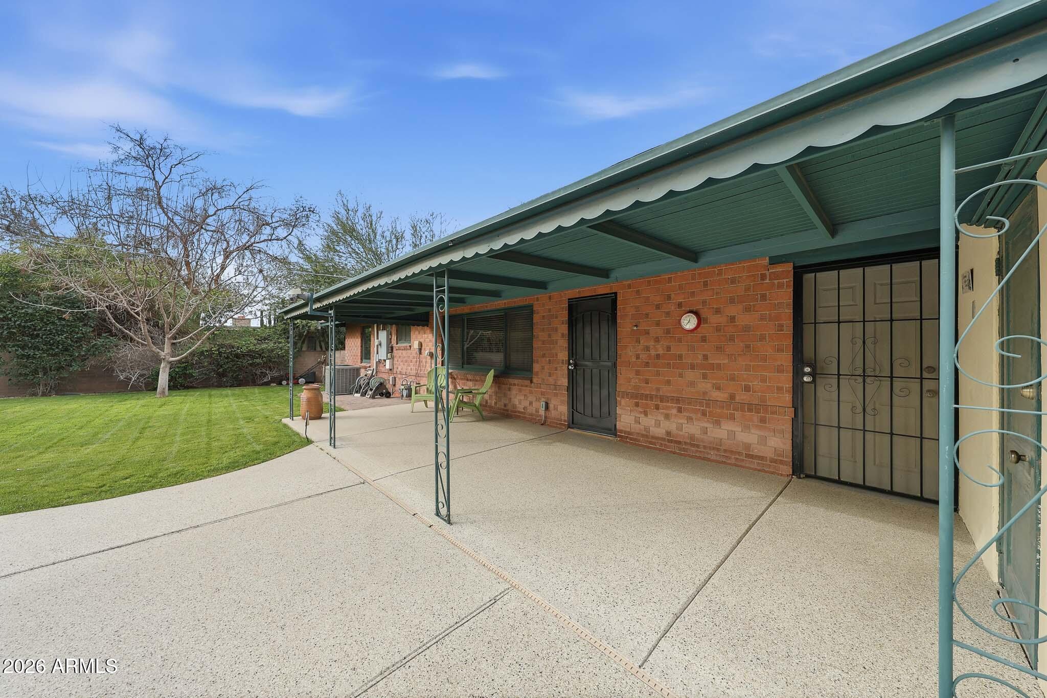 2215 West Earll Drive Phoenix, AZ 85015 - Photo 37 of 55 a view of a house with a yard and garage