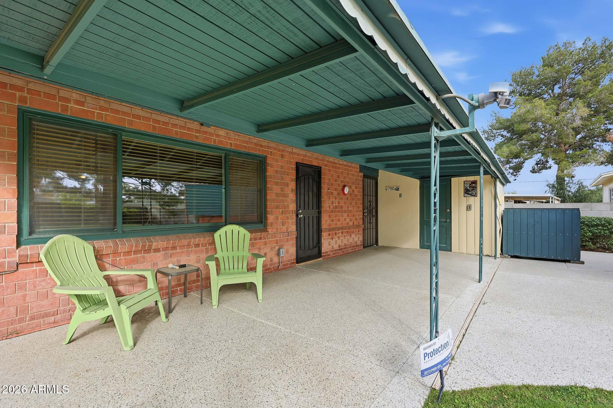 2215 West Earll Drive Phoenix, AZ 85015 - Photo 39 of 55 a patio with a table and chairs and a barbeque