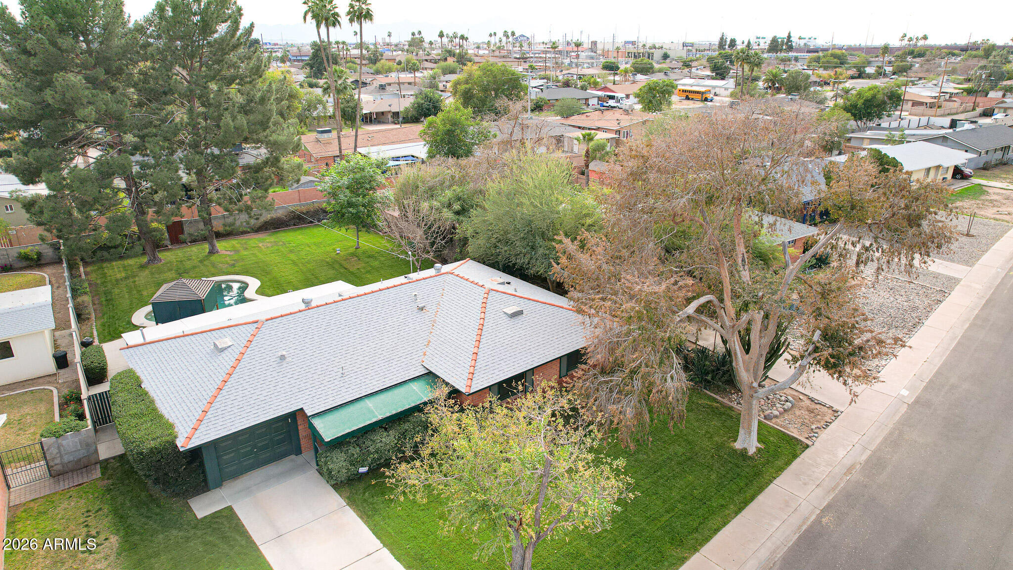 2215 West Earll Drive Phoenix, AZ 85015 - Photo 55 of 55 an aerial view of a house with a garden and lake view
