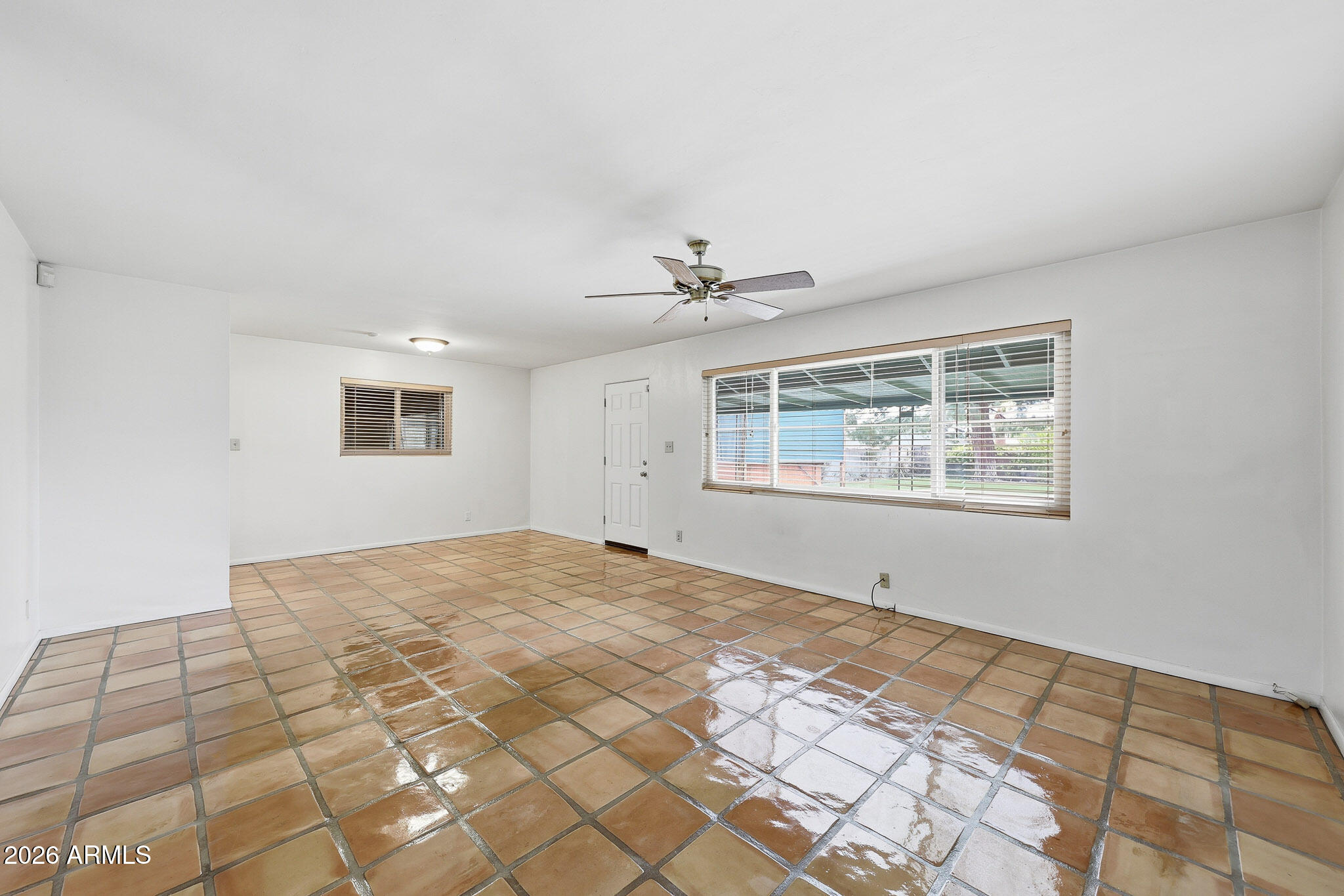 2215 West Earll Drive Phoenix, AZ 85015 - Photo 6 of 55 a view of an empty room with a window