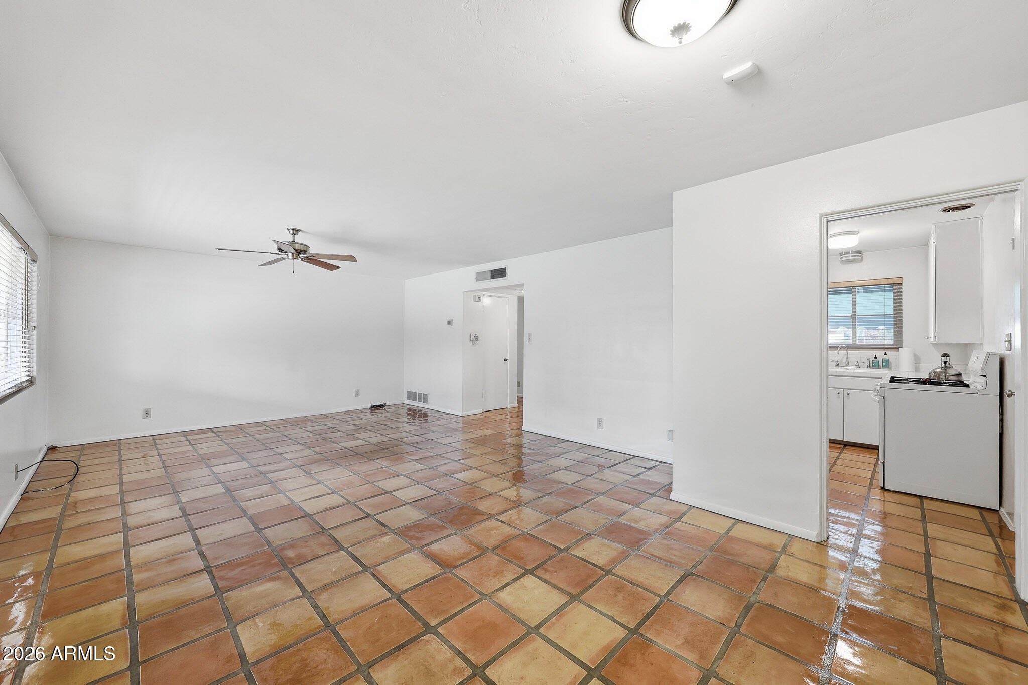 2215 West Earll Drive Phoenix, AZ 85015 - Photo 8 of 55 a view of a livingroom with a dinning table and chair