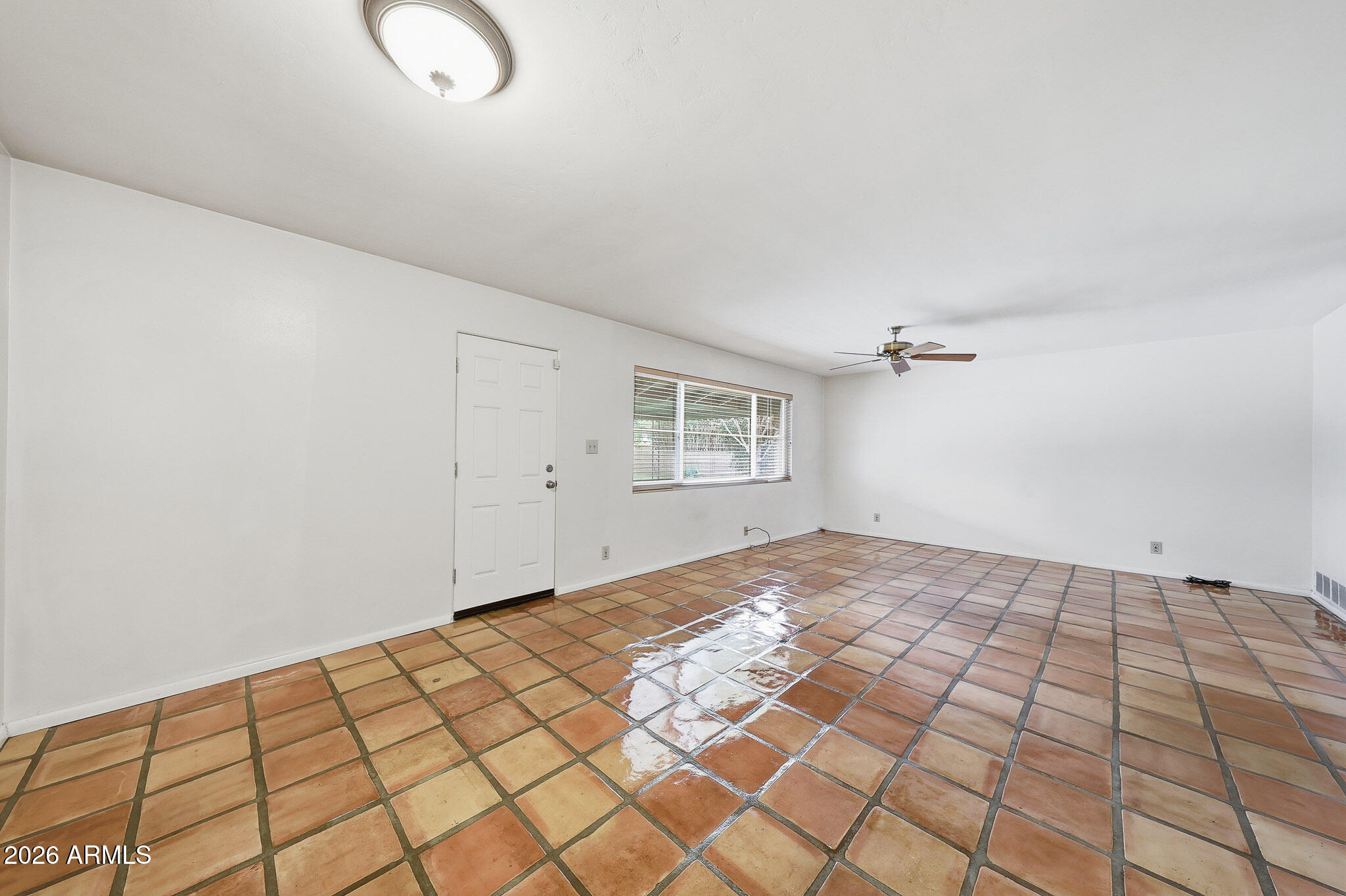 2215 West Earll Drive Phoenix, AZ 85015 - Photo 9 of 55 a view of a bedroom with wooden floor and windows