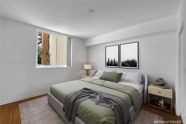 a bedroom with a large bed and a window