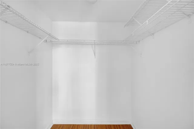 a view of a room with shelf on the wall
