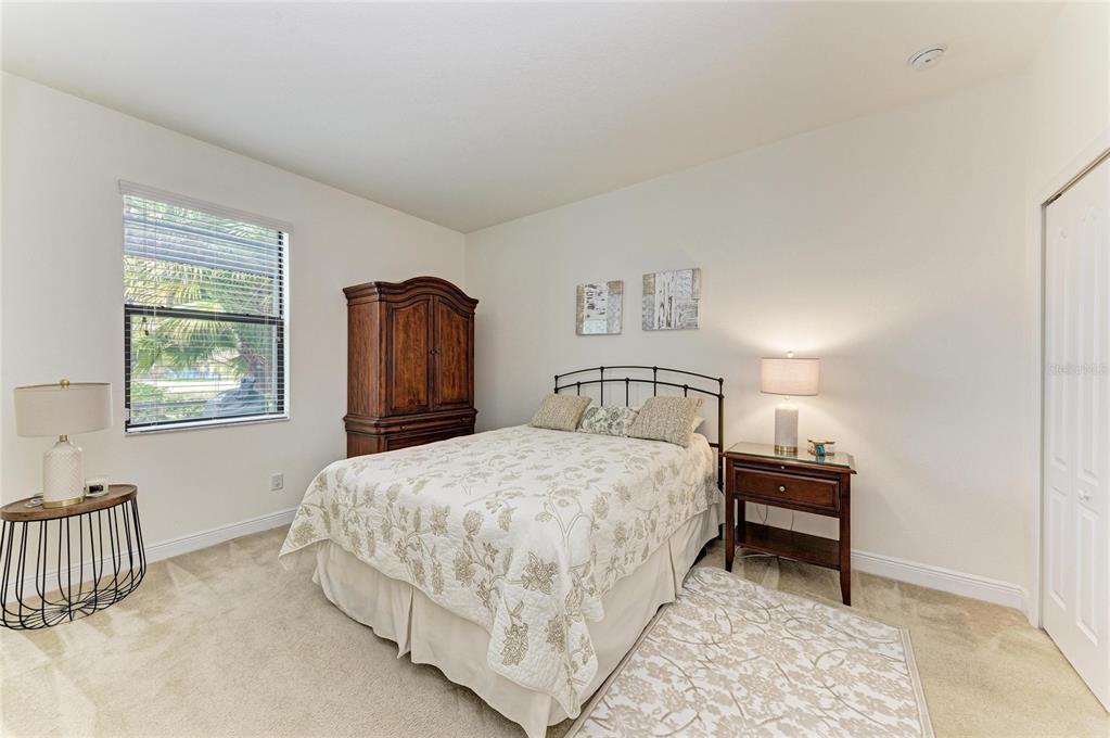 302 Cockle Shell Loop Apollo Beach, FL 33572 - Photo 41 of 75 a bedroom with a bed and a window