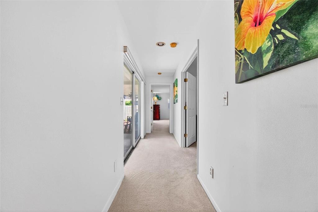 10100 Commodore Drive Seminole, FL 33776 - Photo 18 of 43 a view of a hallway with a white house