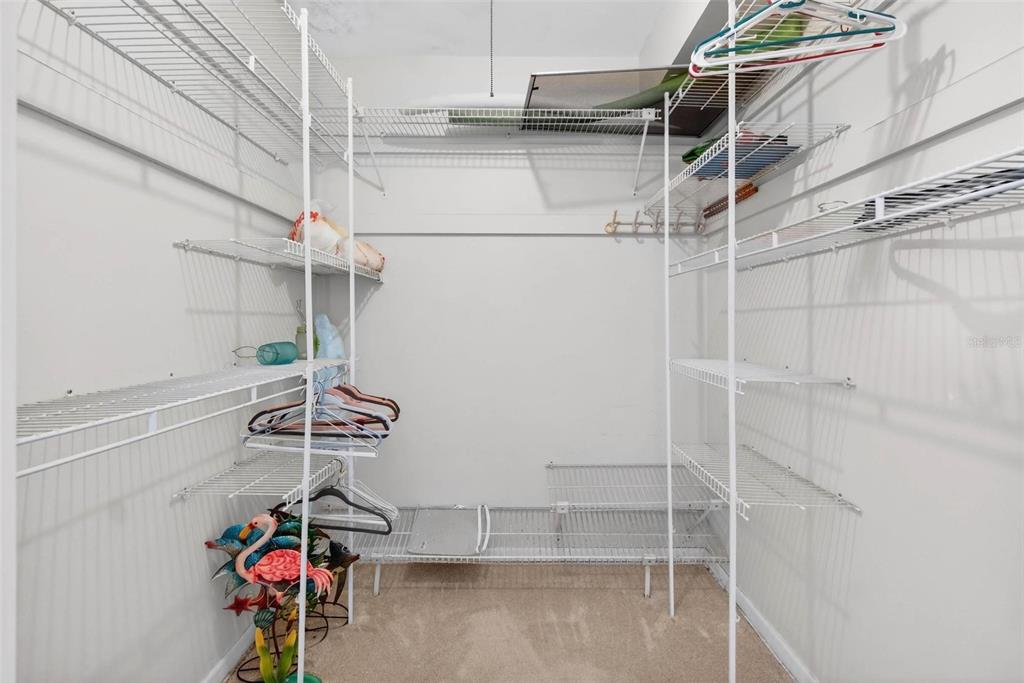 10100 Commodore Drive Seminole, FL 33776 - Photo 26 of 43 a view of storage and utility room with racks on the wall