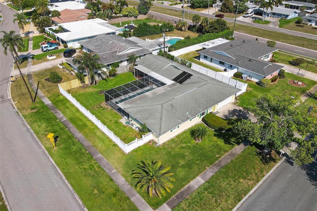 10100 Commodore Drive Seminole, FL 33776 - Photo 39 of 43 an aerial view of a house with a garden