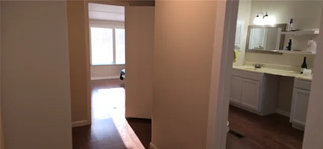 a view of a bathroom from a hallway