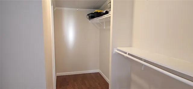 a view of hallway with wooden floor