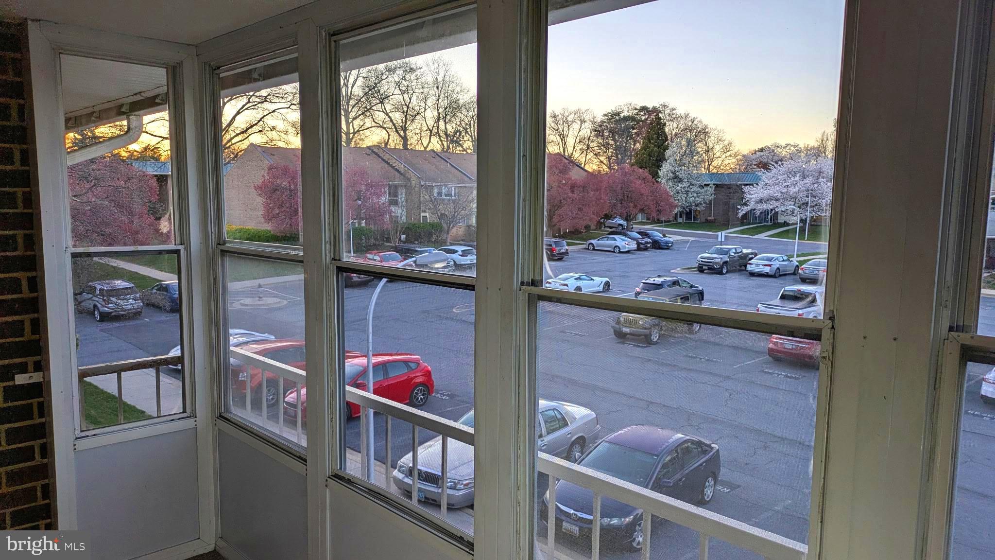 3378 Chiswick Court, Unit 523E Silver Spring, MD 20906 - Photo 21 of 24 a view of a balcony with a floor to ceiling window next to a yard