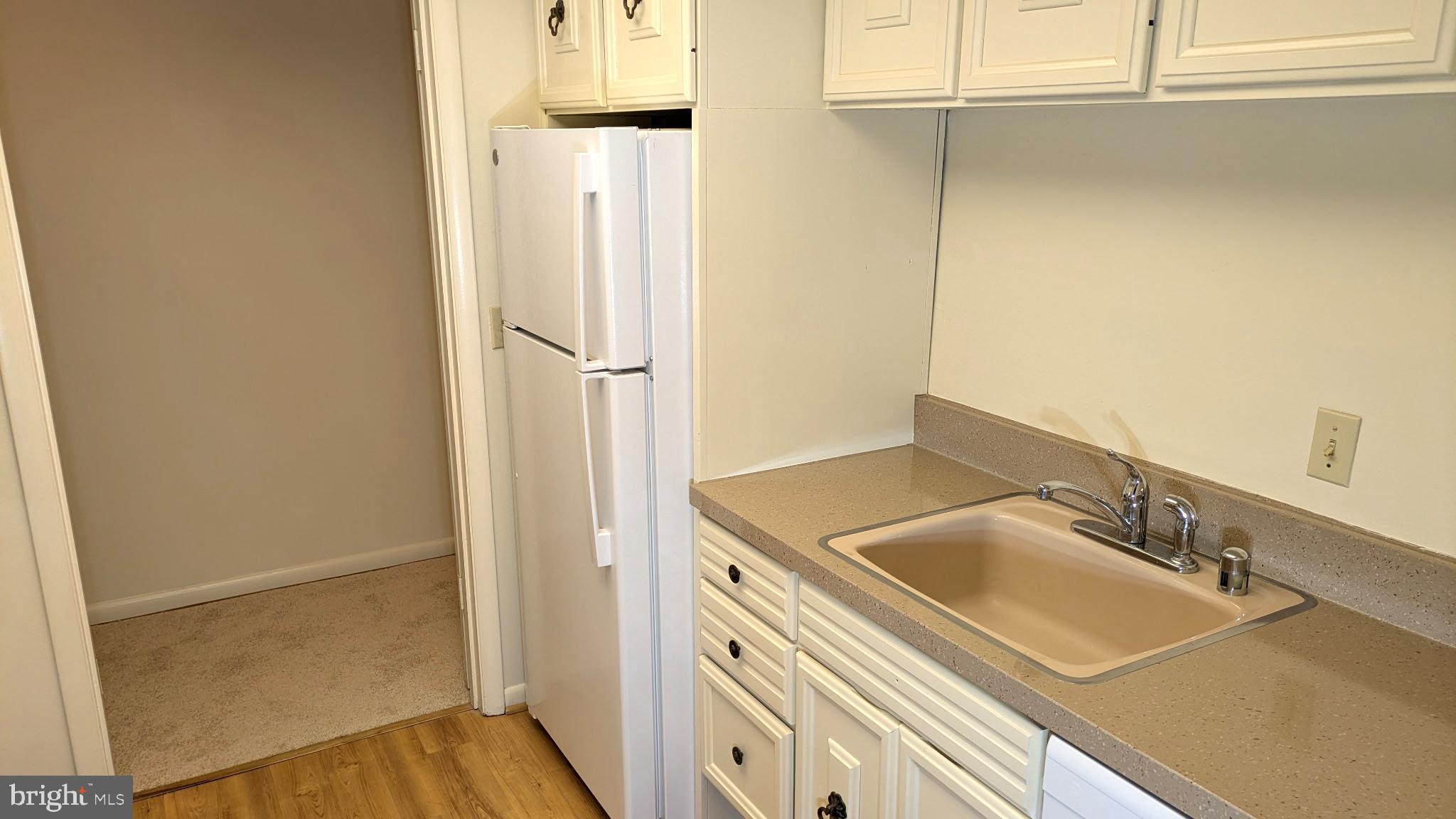 3378 Chiswick Court, Unit 523E Silver Spring, MD 20906 - Photo 5 of 24 a bathroom with a sink and a mirror