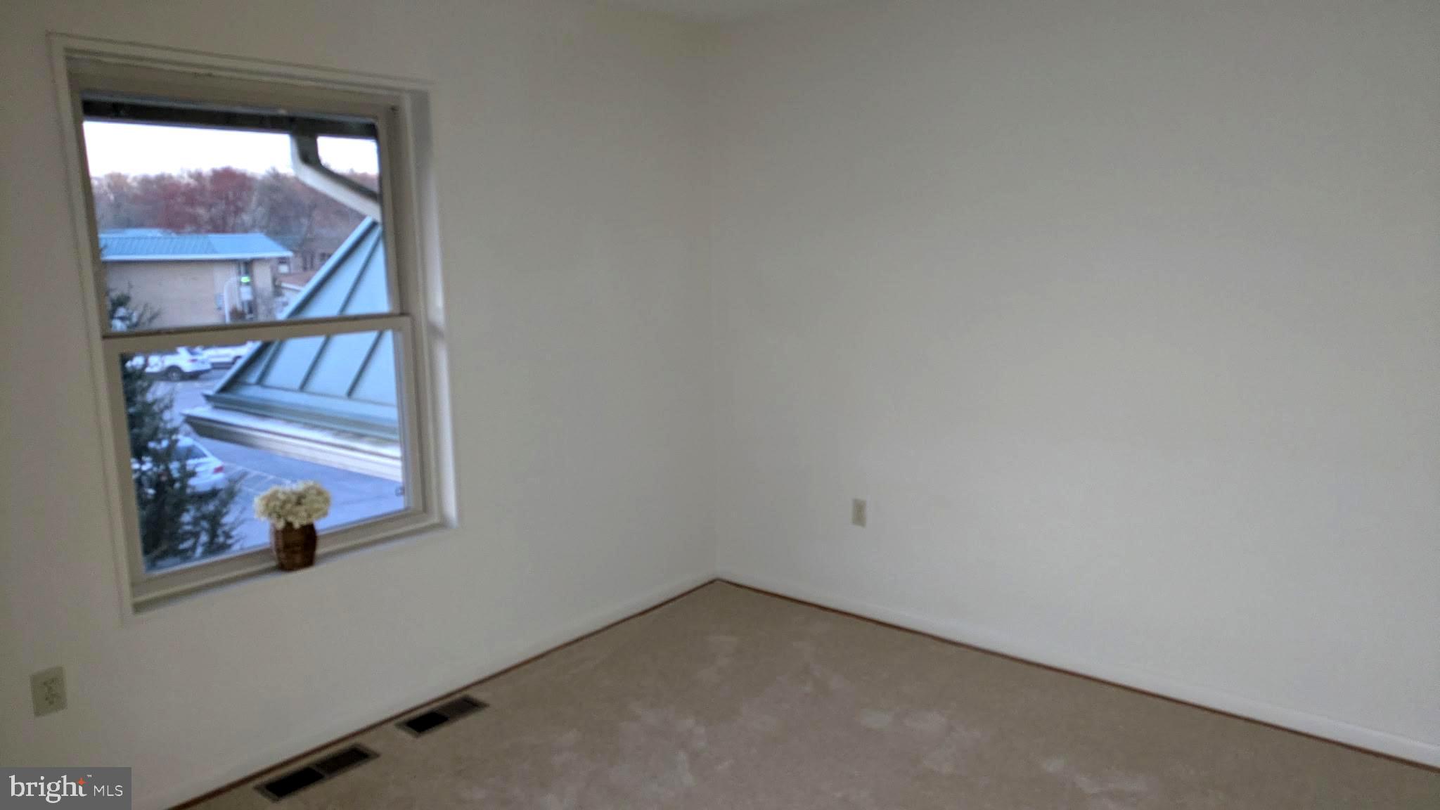 3378 Chiswick Court, Unit 523E Silver Spring, MD 20906 - Photo 9 of 24 a view of an empty room with a window