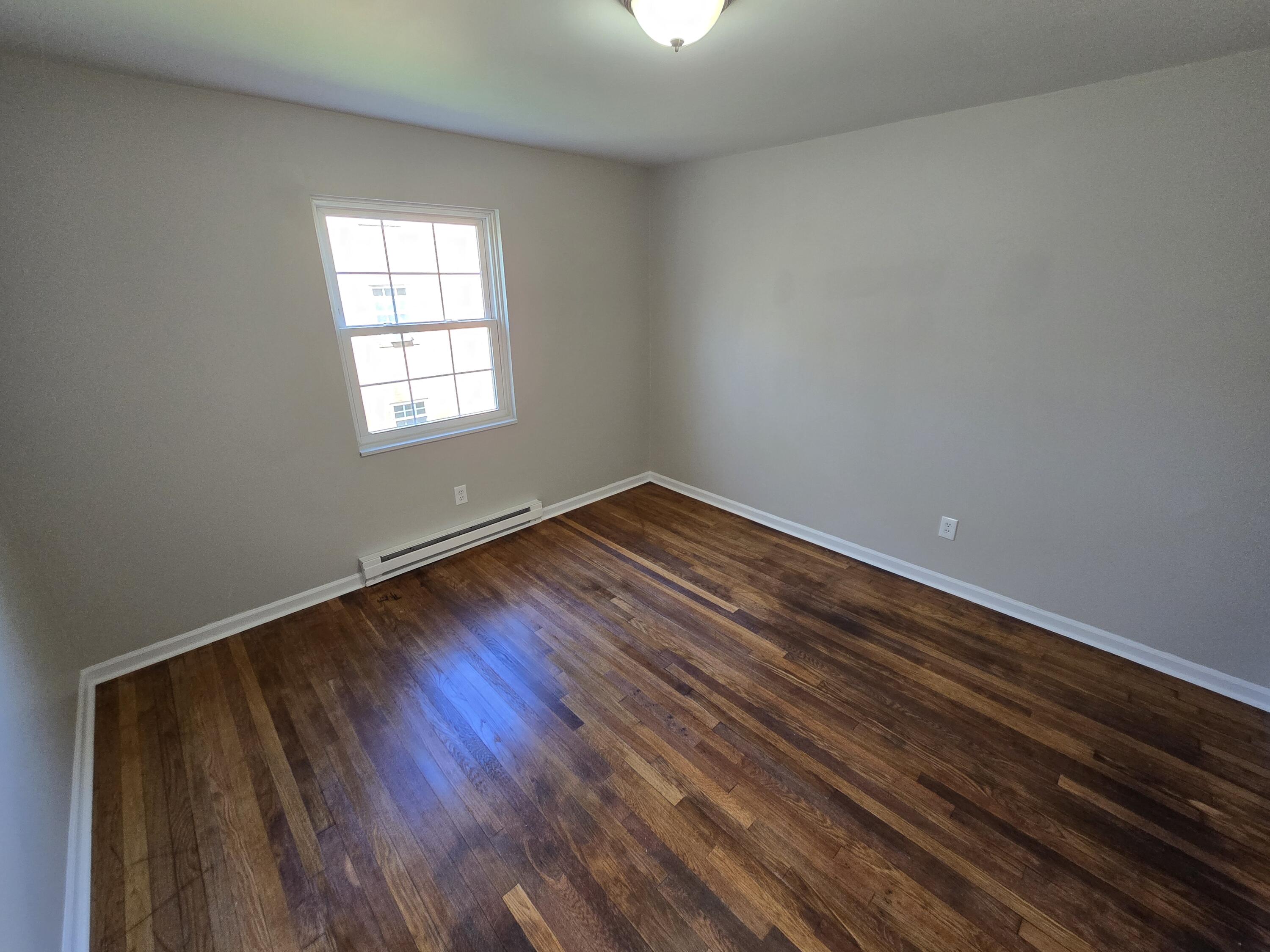 2626 Westover Avenue Southwest, Unit 7 Roanoke, VA 24015 - Photo 7 of 7 wooden floor in an empty room