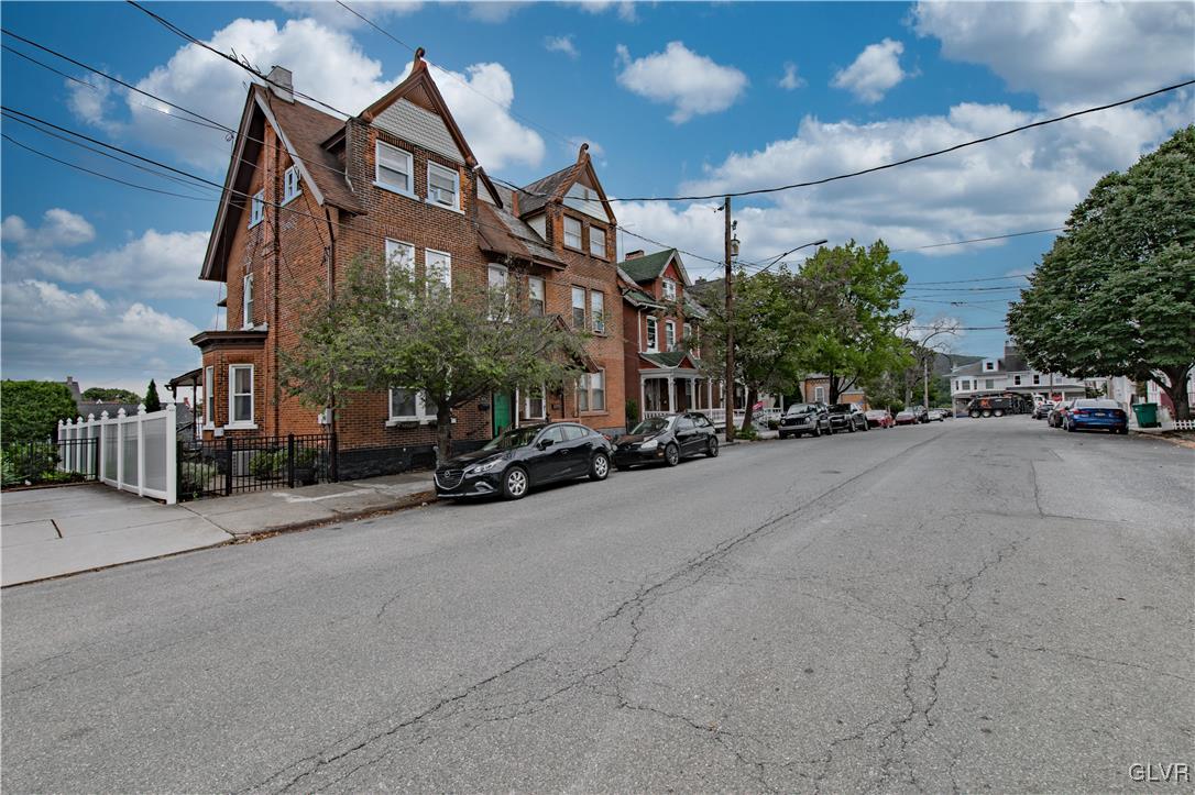 a view of a street with cars