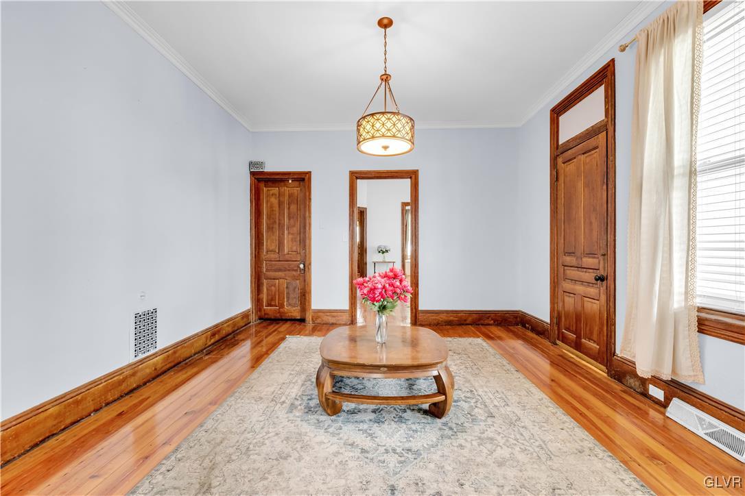426 3rd Avenue Bethlehem, PA 18018 - Photo 11 of 45 a living room with couch chandelier and a window
