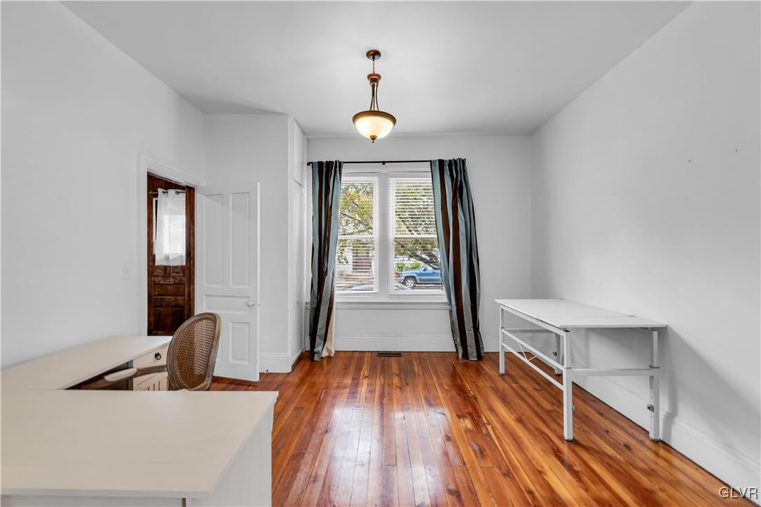 426 3rd Avenue Bethlehem, PA 18018 - Photo 12 of 45 a view of a hallway with wooden floor and furniture