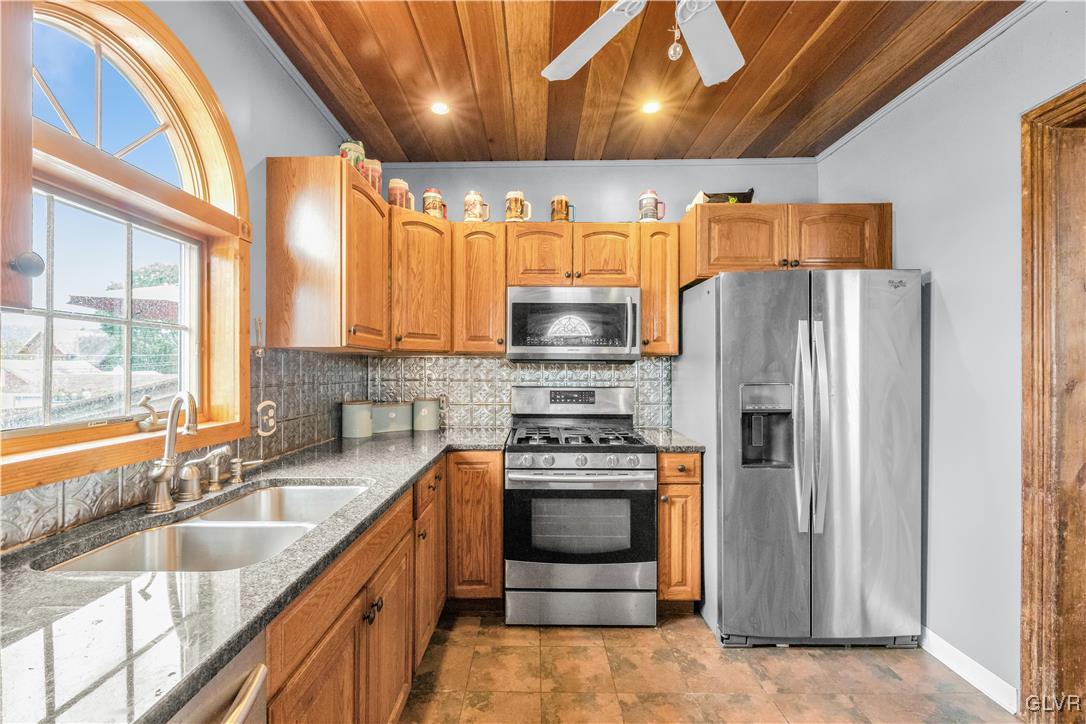 426 3rd Avenue Bethlehem, PA 18018 - Photo 14 of 45 a kitchen with stainless steel appliances granite countertop a sink stove and refrigerator