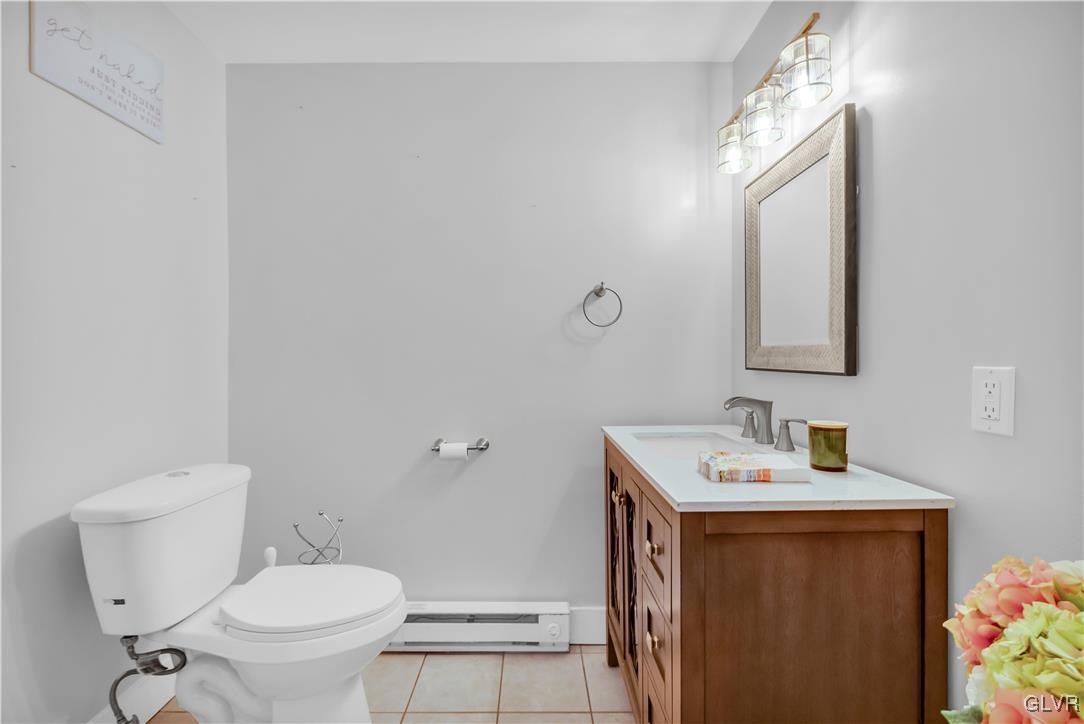 426 3rd Avenue Bethlehem, PA 18018 - Photo 16 of 45 a bathroom with a toilet sink and mirror